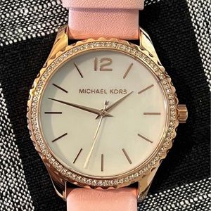 Michael Kors womens watch. Rose gold w/ a pink band.